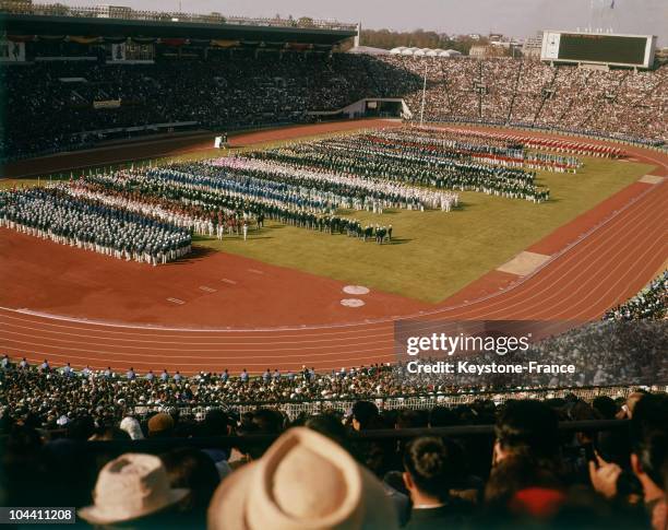 The teams are marching in the stadium during the Tokyo Olympic Games opening ceremony.
