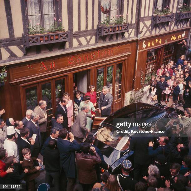 Queen ELIZABETH II on a trip to Orbec, Normandy going to the restaurant AU CANETON.