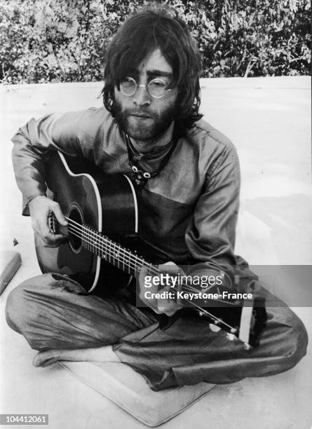 February-March, 1968 : John LENNON playing the guitar in Rishikesh, India where he was following a transcendental course with the rest of the BEATLES...