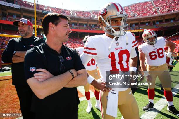 Quarterbacks Coach Rich Scangarello and Jimmy Garoppolo of the San Francisco 49ers stands on the field prior to the game against the Kansas City...