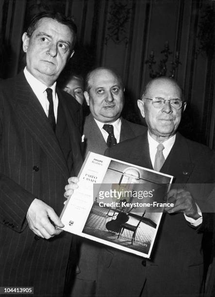 UNSPECIFIED PABLO CASALS IS GIVEN HIS DISK BY GEORGES AURIC 1957