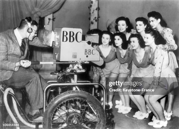 The WINDMILL girls pose for a close-up in front of the television camera during full rehearsal for Britain's television service of the BBC at...