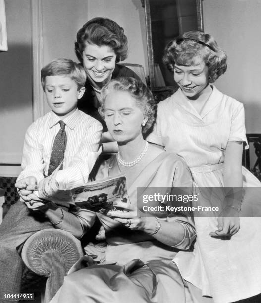 Princess SYBILLA of Sweden reading a magazine for her children, Crown prince CARL GUSTAF, princesses MARGARETHA and CHRISTINA around 1955.