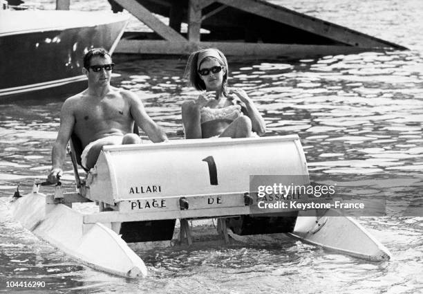 The winner of the Monaco Grand Prix Jackie Stewart and his wife Helen relaxing in a pedal boat in Monaco on May 23, 1966.