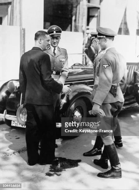 The Secretary General of the Vichy police Rene BOUSQUET speaking with the head of the SS and of the German police in occupied France, General Karl...
