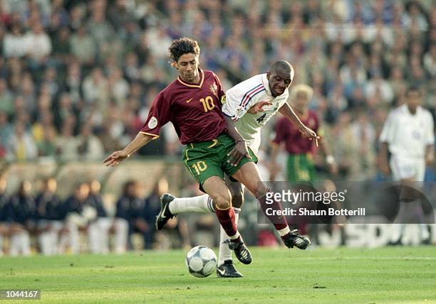 Rui Costa of Portugal holds off Patrick Vieira of France during the European Championships 2000 semi-final at the King Baudouin Stadium in Brussels,...
