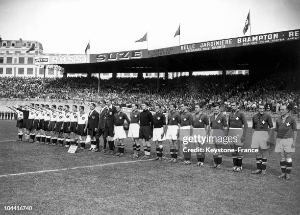 Both football teams Germany and Switzerland greeting each other before their match, as a prelude to the World Cup football at the Parc des Princes,...