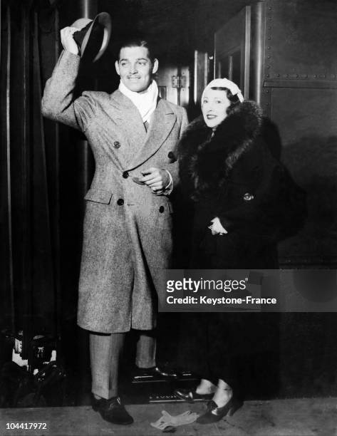 American actor Clark GABLE and his wife Ria LANGHAM arriving at the Grand Central terminal in New York on March 2, 1934.
