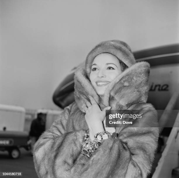 Italian actress and model Elsa Martinelli pictured wearing a fur coat as she arrives at London airport on 18th February 1963. Elsa Martinelli is in...