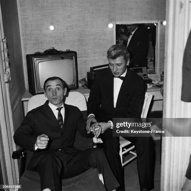 The Singer Johnny Hallyday Taking The Pulse Of Charles Aznavour To Measure The Fever Spawned By Success, In The Dressing Room At The Olympia On...