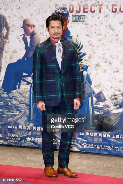 Actor Aaron Kwok Fu-shing poses on the red carpet during the premiere of director Felix Chong Man-Keung's film 'Project Gutenberg' on September 24,...
