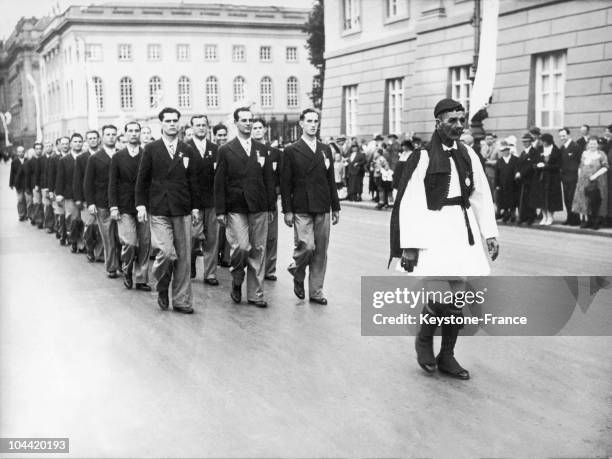 The Greek Men'S Team Filing Through The Streets Of Berlin For The Olympic Games Of 1936, And Being Led By Spiridon Louys, The Former Olympic Marathon...