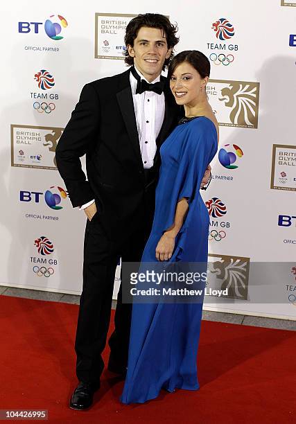 Figure skater John Kerr poses on the red carpet with his partner at the British Olympic Ball at Grosvener House hotel on September 24, 2010 in...