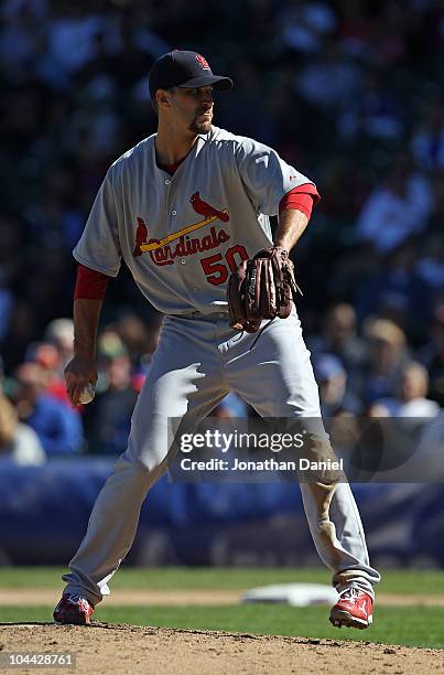 Starting pitcher Adam Wainwright of the St. Louis Cardinals pitches his way to his 20th win of the season against the Chicago Cubs at Wrigley Field...