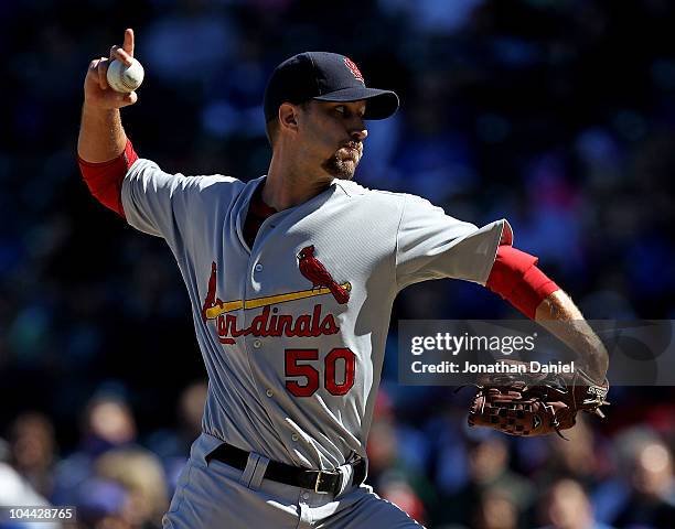 Starting pitcher Adam Wainwright of the St. Louis Cardinals pitches his way to his 20th win of the season against the Chicago Cubs at Wrigley Field...