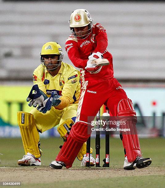 Manish Dhoni hits away as MS Dhoni keeps wicket during the Airtel Champions League Twenty20 semifinal match between Chennai Super Kings and Royal...