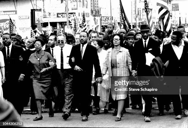 American Civil Rights leaders Dr Martin Luther King Jr and his wife, Coretta Scott King , lead others during on the Selma to Montgomery marches held...