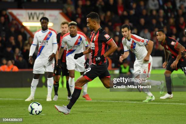 Junior Stanislas of AFC Bournemouth scores from the penalty spot after a foul by Mamadou Sakho of Crystal Palace on Jefferson Lerma of AFC...
