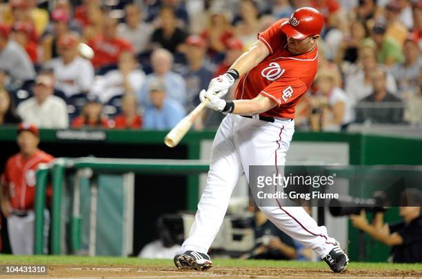 Adam Dunn of the Washington Nationals hits a home run in the second inning against the Atlanta Braves at Nationals Park on September 24, 2010 in...