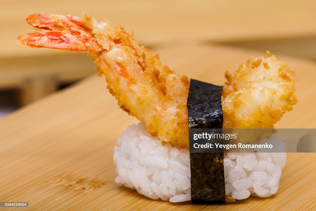 Hot sushi with ebi tempura shrimp on white background
