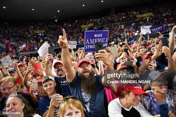 Supporters cheer US President Donald Trump during a "Make America Great Again" rally at Freedom Hall Civic Center in Johnson City, Tennessee on...