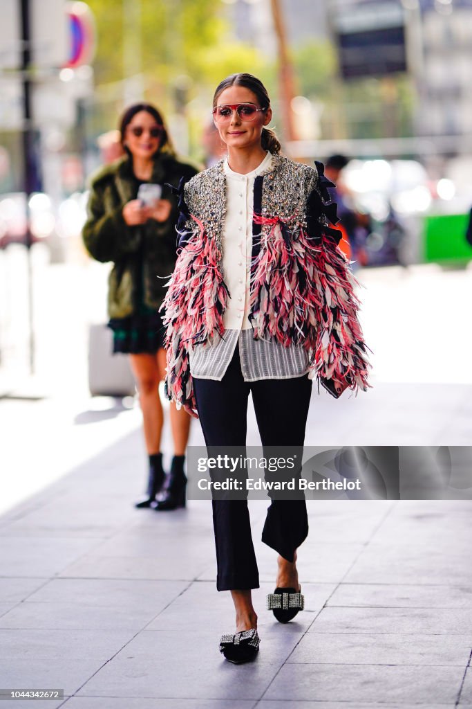 Olivia Palermo wears a tweed jacket with embroidered pink fringes and ...