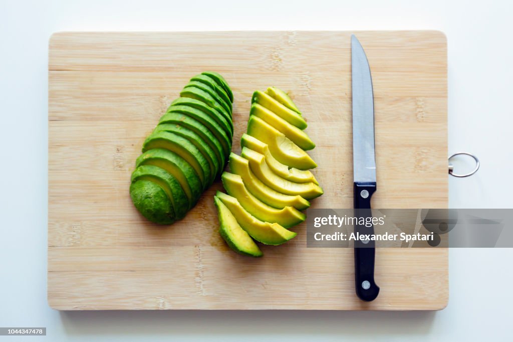 Freshly cut sliced avocado on a cutting board