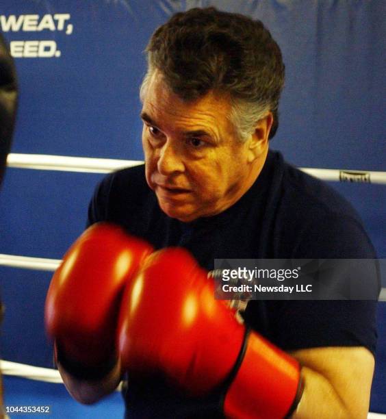 Congressman Peter King getting a workout boxing with his trainer in Bellmore, New York on December 20, 2004.