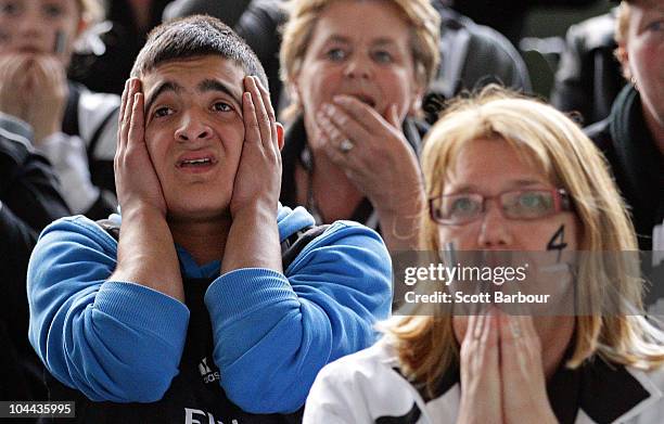 Collingwood fans react at full time as they watch the AFL Grand Final match between the Collingwood Magpies and the St Kilda Saints on a large...