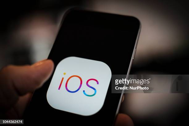The Apple iOS logo is seen on an Apple iPhone on October 1, 2018. Apples latest realese of its mobile device operating system, version 12 has been...