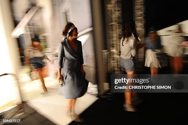 Models get ready backstage prior the Elena Miro spring-summer 2011ready-to-wear collection on September 22, 2010 during the Women's fashion week in...
