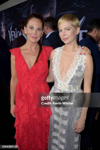 Kelly Marcel and Michelle Williams attend the premiere of Columbia Pictures' 'Venom' at Regency Village Theatre on October 1, 2018 in Westwood,...