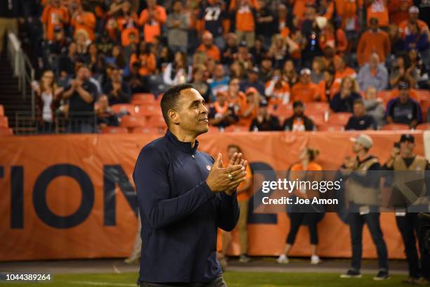 Dennis Smith takes the field during the halftime show as the Denver Broncos played the Kansas City Chiefs at Broncos Stadium at Mile High.