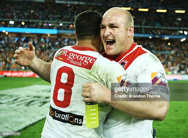 Michael Weyman and Neville Costigan of the Dragons celebrate after victory over the Tigers during the Second NRL Preliminary Final match between the...