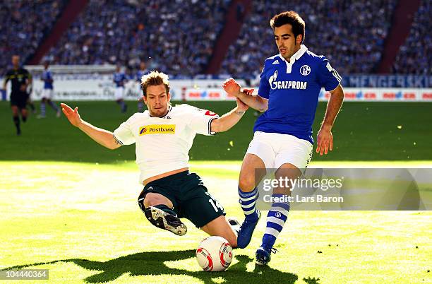 Thorben Marx of Moenchengladbach challenges Jurado of Schalke during the Bundesliga match between FC Schalke 04 and Borussia Moenchengladbach at...