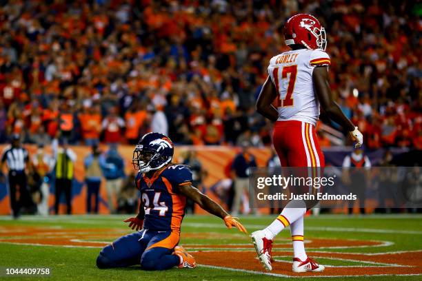 Defensive back Adam Jones of the Denver Broncos celebrates after breaking up a pass intended for wide receiver Chris Conley of the Kansas City Chiefs...