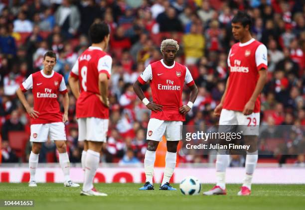 Laurent Koscielny, Samir Nasri, Alex Song and Marouane Chamakh of Arsenal look dejected as Peter Odemwingie of West Bromwich Albion scores their...