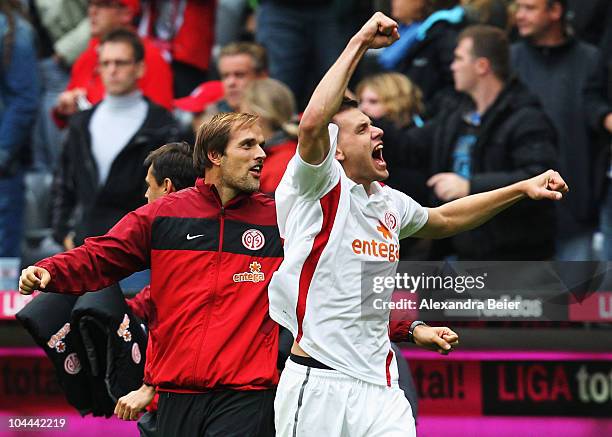 Team coach Thomas Tuchel and Adam Szalai of Mainz celebrate victory after the Bundesliga first league match between FC Bayern Muenchen and FSV Mainz...