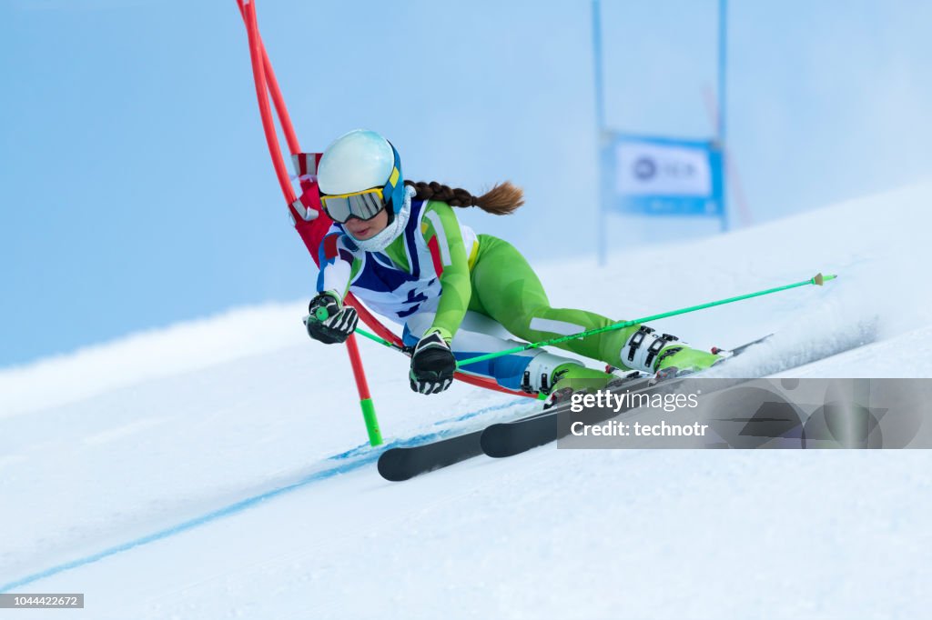 Young Women at Giant Slalom Against the Blue Sky