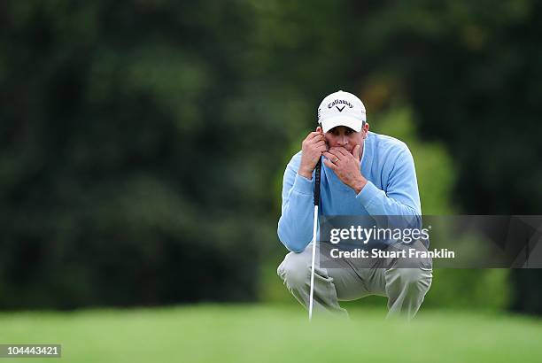 Francois Delamontagne of France lines up his putt on the nineth hole during the third round of the Vivendi cup at Golf de Joyenval on September 25,...