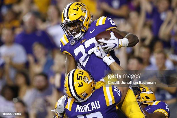 Clyde Edwards-Helaire of the LSU Tigers celebrates a touchdown during the first half against the Louisiana Tech Bulldogs at Tiger Stadium on...