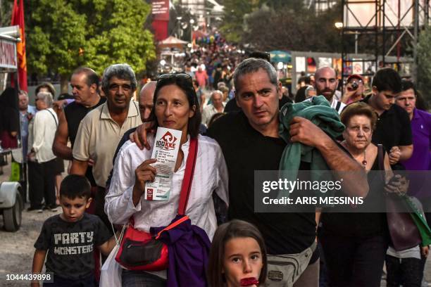 People visit an annual festival of the Greek Communist party youth wing in Athens on September 22, 2018. - The Greek Communist party -- KKE -- turns...