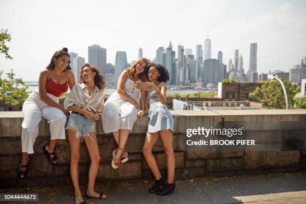 young females hanging out in city - public building stock photos et images de collection