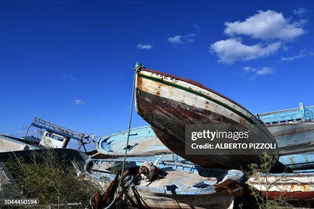 The so-called boat cemetery, where skiffs are dumped after the migrants and refugees' crossing from North Africa, is pictured in Lampedusa on...