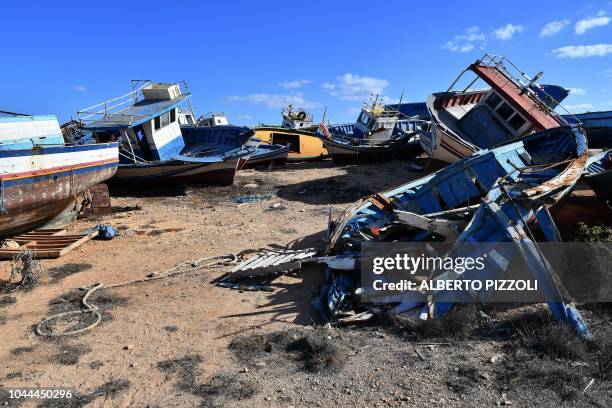 The so-called boat cemetery, where skiffs are dumped after the migrants and refugees' crossing from North Africa, is pictured in Lampedusa on...