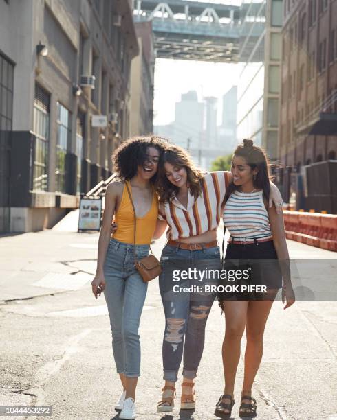 young females hanging out in city - denim shorts fotografías e imágenes de stock