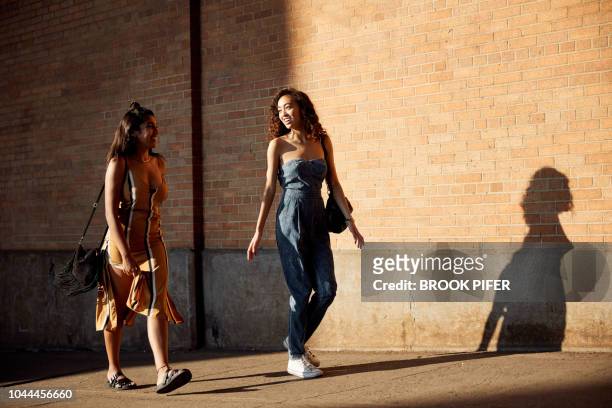 young females hanging out in city - beige dress stock pictures, royalty-free photos & images