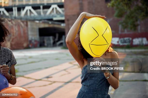 female having fun with party balloon - friendship over stock pictures, royalty-free photos & images