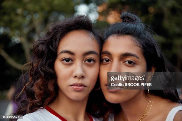 portrait of young women in city - beautiful east indian women stockfoto's en -beelden