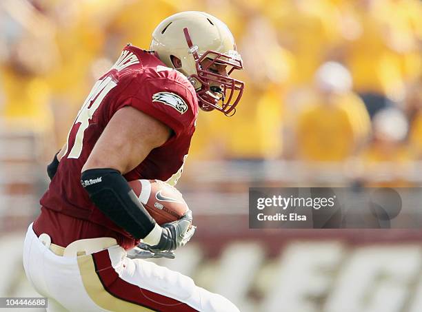 Mark Herzlich of the Boston College Eagles carries the ball after he intercepted a pass from Tyrod Taylor of the Virginia Tech Hokies on September...